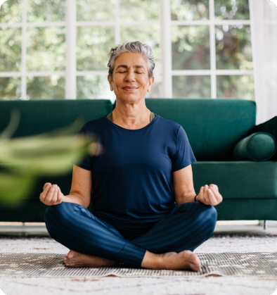 A woman sitting in the middle of her yoga practice.